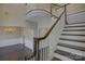 Elegant foyer featuring hardwood floors, staircase with white banister and formal dining room at 17809 Pawleys Plantation Ln, Charlotte, NC 28278