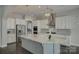 Bright kitchen features granite counters, stainless steel appliances and modern pendant lighting at 17809 Pawleys Plantation Ln, Charlotte, NC 28278