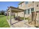 Brick patio with a pergola and outdoor seating, ideal for entertaining in the landscaped backyard at 17809 Pawleys Plantation Ln, Charlotte, NC 28278