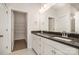 Bathroom featuring double sink vanity, large mirror and walk-in closet at 2021 Summey Ave, Charlotte, NC 28205