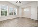 Light and bright bedroom with ceiling fan and multiple windows for natural light at 2021 Summey Ave, Charlotte, NC 28205