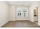 Empty bedroom with luxury vinyl flooring and ample natural light at 2021 Summey Ave, Charlotte, NC 28205