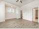 Spacious bedroom with luxury vinyl flooring, ceiling fan and closet at 2021 Summey Ave, Charlotte, NC 28205