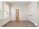 Bedroom with closet and ensuite bathroom with hardwood floors at 2021 Summey Ave, Charlotte, NC 28205