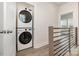 Upstairs laundry area with stacked washer and dryer unit at 2021 Summey Ave, Charlotte, NC 28205