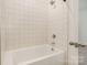 Close-up of a bright white tiled shower area featuring modern shower head and fixtures at 2021 Summey Ave, Charlotte, NC 28205