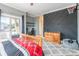 Comfortable bedroom featuring gray walls, carpeted floors, and access to the outdoor balcony at 2036 Rocky Stream Rd, York, SC 29745