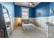 Charming bedroom with blue walls, carpeted floors, and a large mirror at 2036 Rocky Stream Rd, York, SC 29745