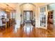 Inviting foyer with hardwood floors, elegant chandelier, and views into dining and living areas at 2036 Rocky Stream Rd, York, SC 29745