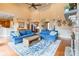 Bright living room features a fireplace and view of the dining room, kitchen, and staircase at 2036 Rocky Stream Rd, York, SC 29745