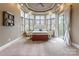 Main bedroom features neutral carpet, an abundance of natural light, and private balcony access at 2036 Rocky Stream Rd, York, SC 29745