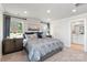 Bedroom with grey patterned bedding, and ensuite bathroom at 2080 Old Rivers Rd, Concord, NC 28027