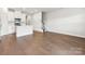 Open living space featuring hardwood floors that flow into the bright kitchen area at 2080 Old Rivers Rd, Concord, NC 28027