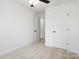 Cozy bedroom with neutral carpet, ceiling fan, and white trim at 211 E Rice St, Landis, NC 28088