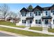 Inviting new construction townhouse with white picket fence and manicured lawn at 211 E Rice St, Landis, NC 28088