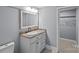 Bathroom with a white vanity, framed mirror, and neutral wall color at 220 W Bell St, Statesville, NC 28677