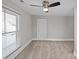 Bedroom featuring carpet, natural light from large window and ceiling fan at 220 W Bell St, Statesville, NC 28677