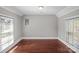 Well-lit bedroom with hardwood floors and large windows that creates a cozy space at 220 W Bell St, Statesville, NC 28677