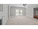 Bright bedroom with a ceiling fan and two large windows offering natural light at 220 W Bell St, Statesville, NC 28677