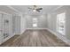 Bedroom featuring hardwood floors, ample storage, a ceiling fan, and bright natural light at 220 W Bell St, Statesville, NC 28677