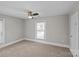 Bedroom featuring neutral carpet, ceiling fan, natural light and painted walls at 220 W Bell St, Statesville, NC 28677