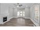 Spacious living room featuring a fireplace with stylish mosaic tile and a bay window at 220 W Bell St, Statesville, NC 28677