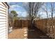 A fenced backyard with mulch and stone stepping stones leading to an air conditioning unit near a home at 2324 Brookview Ct, Rock Hill, SC 29732