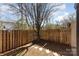 Fenced backyard featuring stone stepping stones and a mature tree, offering a private outdoor space at 2324 Brookview Ct, Rock Hill, SC 29732