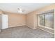 Bedroom featuring carpet flooring, ceiling fan, and natural light from the large window at 2324 Brookview Ct, Rock Hill, SC 29732