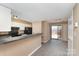 Open concept kitchen features sleek countertops, white cabinets, and modern black appliances at 2324 Brookview Ct, Rock Hill, SC 29732