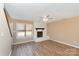 Bright living area with neutral walls, wood-look flooring, and a fireplace at 2324 Brookview Ct, Rock Hill, SC 29732