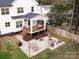 Aerial view of backyard featuring a covered patio, fire pit, and outdoor dining area at 2626 Palm Ave, Charlotte, NC 28205