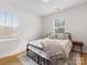 Light, bright bedroom with hardwood floors and two windows at 2626 Palm Ave, Charlotte, NC 28205