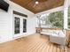 Covered deck with wood ceiling, ceiling fan, and comfortable outdoor seating at 2626 Palm Ave, Charlotte, NC 28205