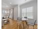 Bright dining area with hardwood floors and a round table, perfect for casual meals at 2626 Palm Ave, Charlotte, NC 28205