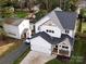 Aerial view of a stunning home featuring a manicured lawn and ample parking at 2626 Palm Ave, Charlotte, NC 28205