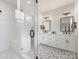 Modern main bathroom with a glass-enclosed shower, dual vanities, and designer tile flooring at 2626 Palm Ave, Charlotte, NC 28205