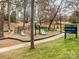 Playground at Shamrock Park with play equipment, climbing structures, and benches at 2626 Palm Ave, Charlotte, NC 28205