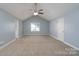 Primary bedroom with vaulted ceiling, neutral carpet, and a window for natural light at 280 Bonaventure Dr, Salisbury, NC 28147