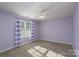 Light purple bedroom with plush carpet, a window with curtains, and ample space at 280 Bonaventure Dr, Salisbury, NC 28147