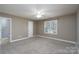 Neutral bedroom featuring a ceiling fan, plush carpet, and ample natural light at 280 Bonaventure Dr, Salisbury, NC 28147