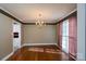 Classic dining room with hardwood floors, chandelier, and large window at 280 Bonaventure Dr, Salisbury, NC 28147