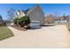 Two-story home with a two-car garage and a large concrete driveway at 280 Bonaventure Dr, Salisbury, NC 28147