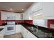 Bright kitchen features granite countertops, white cabinets, and stainless steel appliances at 280 Bonaventure Dr, Salisbury, NC 28147