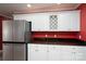 Kitchen area featuring stainless steel refrigerator and white cabinets at 280 Bonaventure Dr, Salisbury, NC 28147