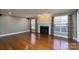 Bright living room featuring hardwood floors, a fireplace, and large windows at 280 Bonaventure Dr, Salisbury, NC 28147