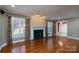 Inviting living room with hardwood floors, fireplace, and multiple windows at 280 Bonaventure Dr, Salisbury, NC 28147