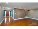 Open-concept living area with hardwood flooring and neutral wall colors at 280 Bonaventure Dr, Salisbury, NC 28147