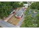 Aerial view of property showcasing home, detached garage, and landscaped surroundings at 2909 Glendale Ave, Kannapolis, NC 28081