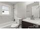 Updated bathroom with a tub and shower combination, marble-style tile, and a modern vanity at 2909 Glendale Ave, Kannapolis, NC 28081